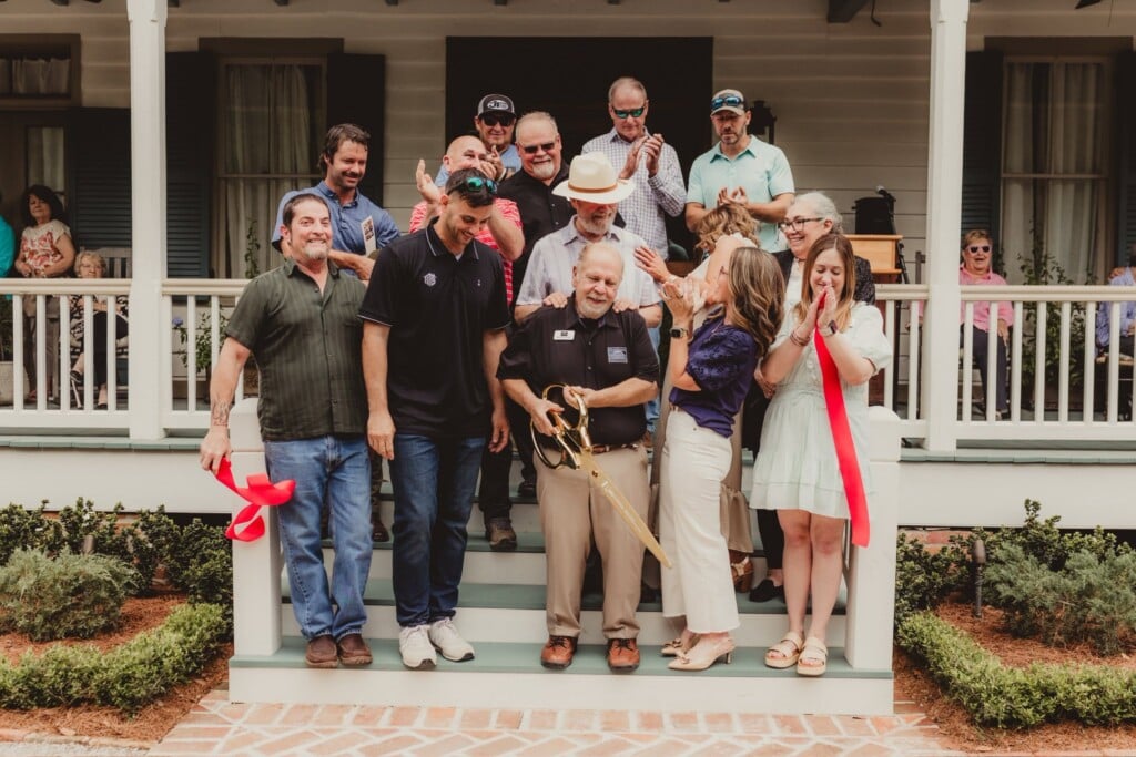 BeauBassin Farm & Gardens Ribbon-Cutting Ceremony. People Gathered on the steps of the house at BeauBassin Farm & Gardens as ribbon was just cut.