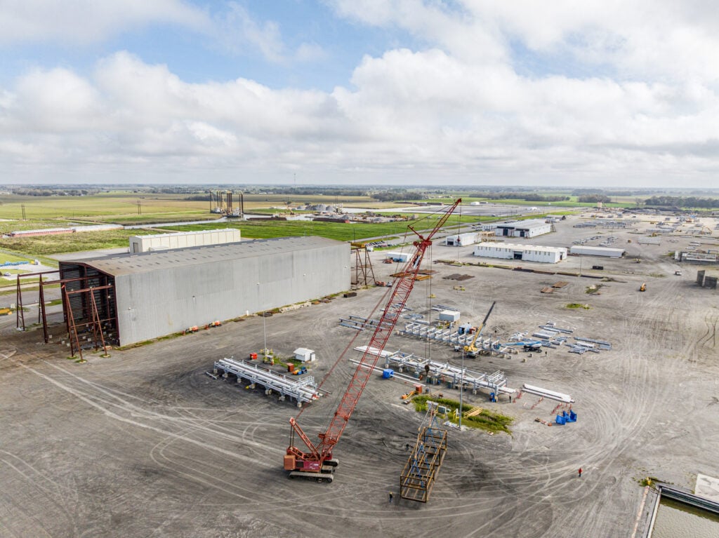 New Iberia Modular Facility for Turner Industries nuclear fabrication expansion. Aerial view of site with sky, land and equipment