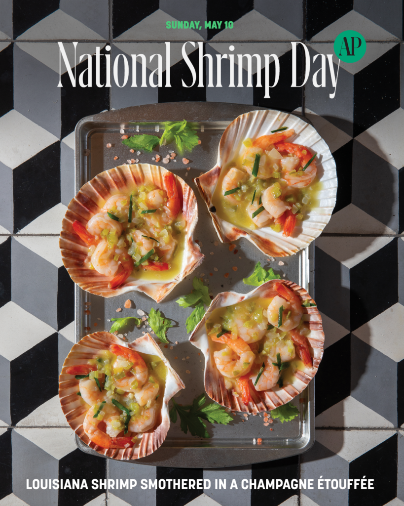 Showing Shrimp in Champagne Etouffe in shells on a pan
