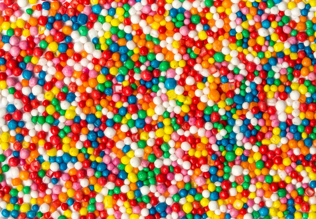 Macro view of colourful array of tiny of confectionary sprinkles