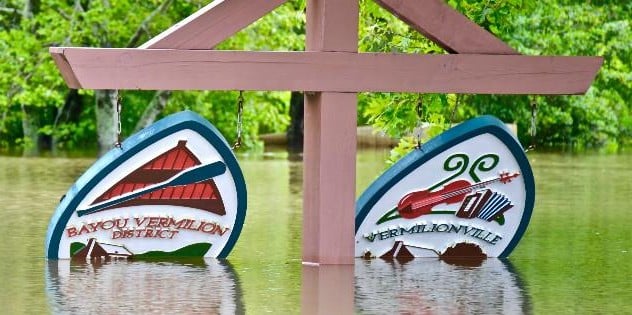 Bayou Vermilion signs underwater from 2016 floods in Acadiana