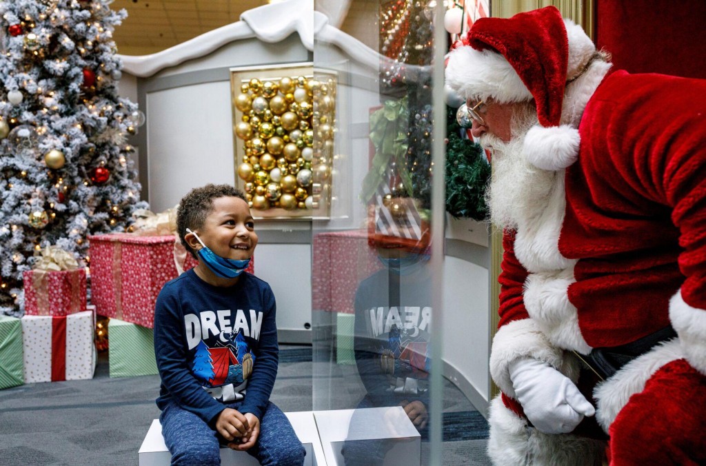 Here Comes Santa Claus — With Face Masks And Plexiglass