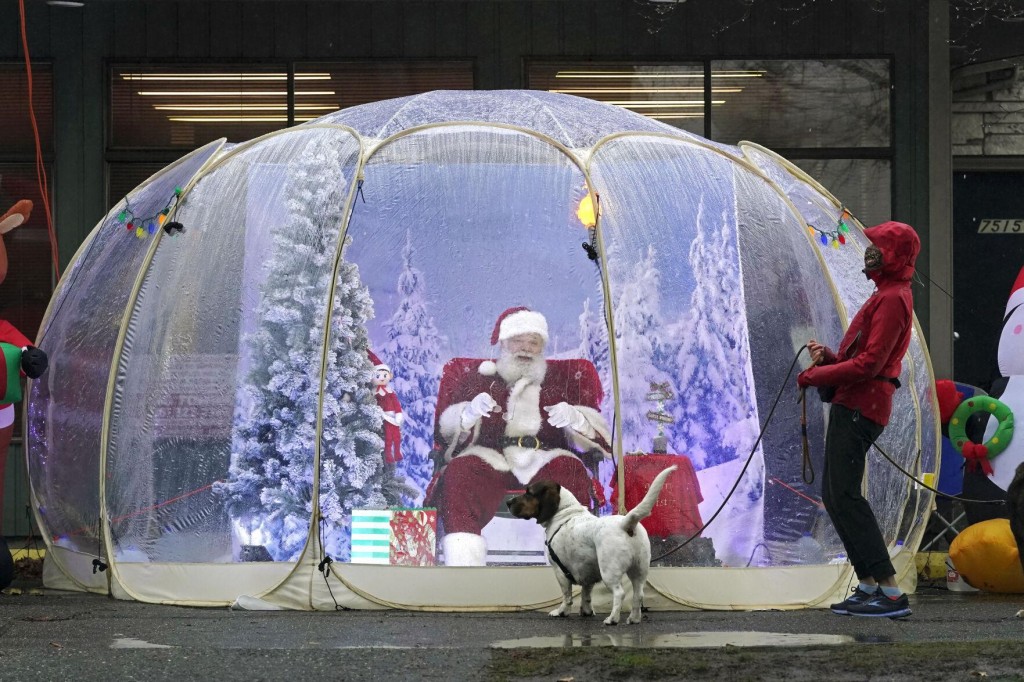 Photos: From Snow Globes To Zoom, Here’s How We’re Keeping Santa Safe In 2020