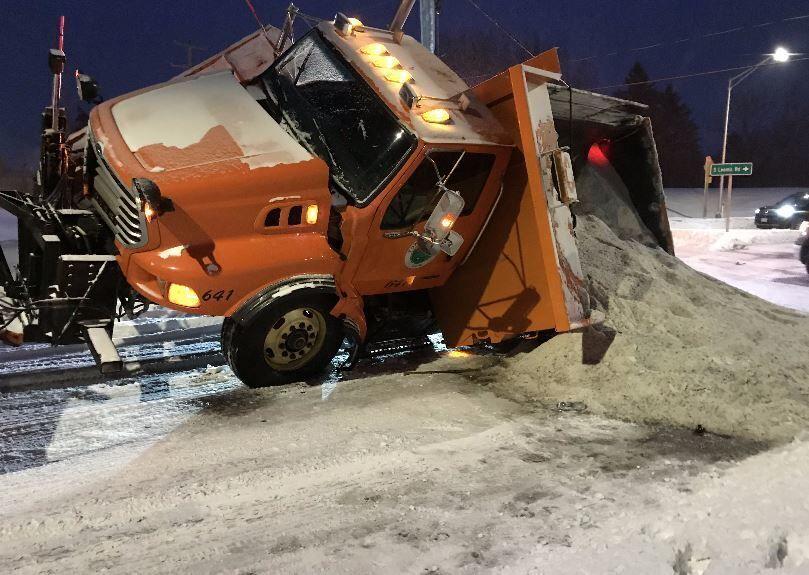 Oops! Tow Truck Loses Control Of Disabled Snowplow In Town Of Norway Roundabout