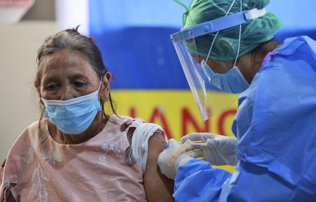 The Latest: New Zealand To Use Only Pfizer Virus Vaccine