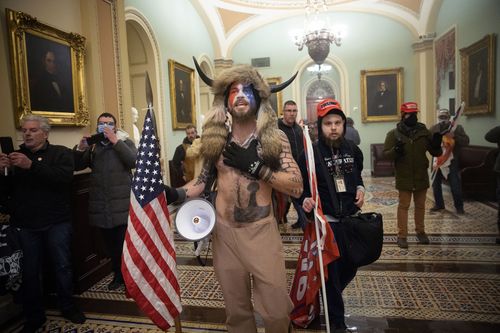 ‘qanon Shaman’ Must Remain In Jail, Judge Rules