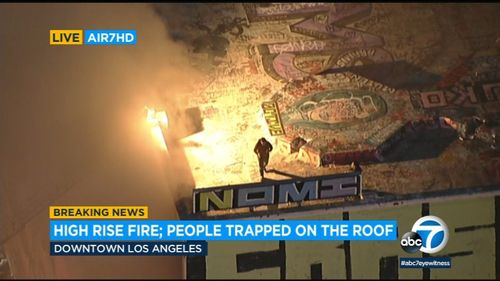 Multiple People Left Stranded On Roof Building After Fire Erupts