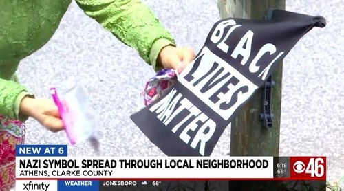 Neighborhood Shocked To Find Nazi Stickers On Flags And Signs In Front Yards