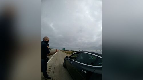 A Driver Appeared To Be Sleeping Behind The Wheel Of An Autonomous Tesla, Authorities Say. So Deputies Pulled Him Over