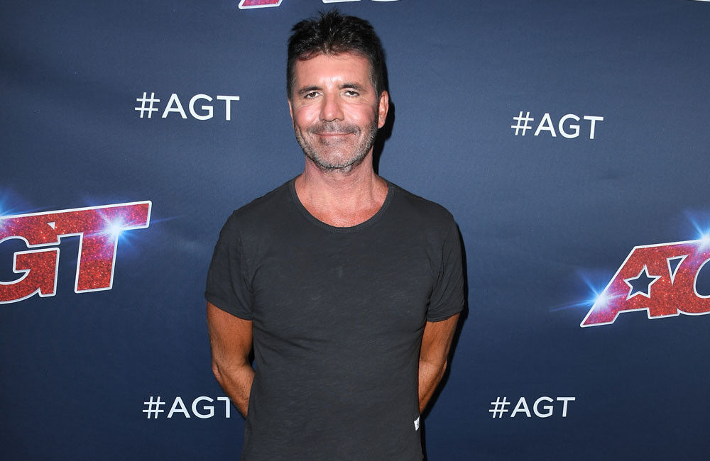 Simon Cowell Thinks He Can Reunite One Direction