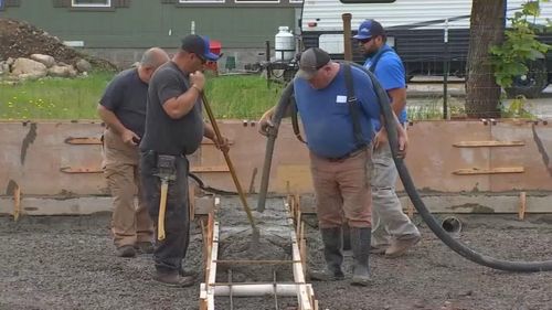 Volunteers Travel Thousands Of Miles To Help In Wildfire Rebuild Efforts