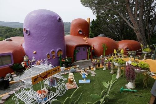 California’s ‘flintstone House’ Can Keep Its Cartoon Statues Thanks To A Settlement