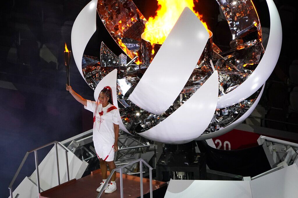 Naomi Osaka Lights Tokyo Games Cauldron With Olympic Flame. See Scenes From The Opening Ceremony.
