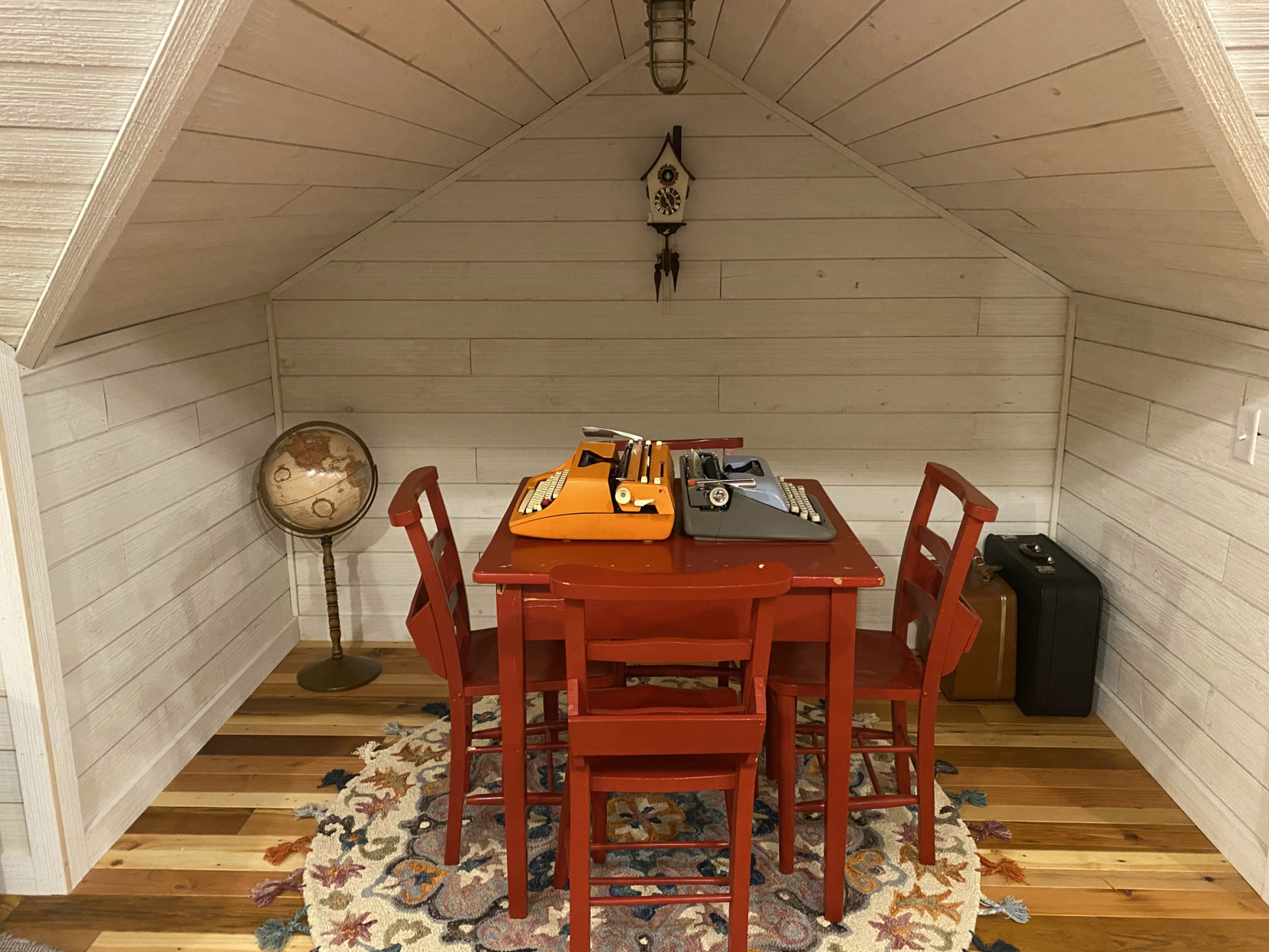 <p>The secret playroom features a table with typewriters. </p>