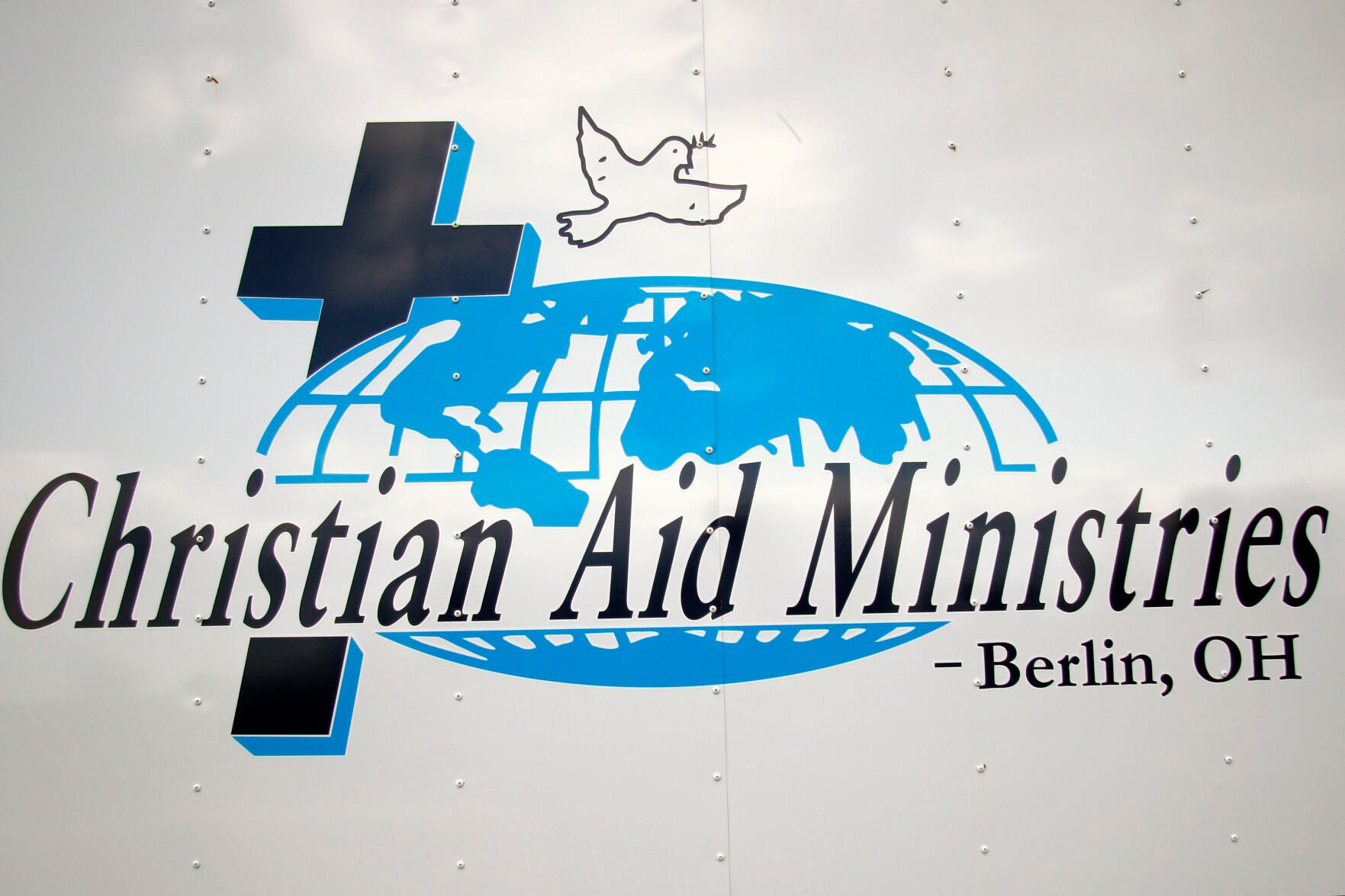 <p>This photo shows the logo for Ohio-based Christian Aid Ministries, which sent a voice message saying that a group of 17 missionaries including children had been kidnapped by a gang in Haiti. The message said the missionaries were on their way home from building an orphanage.</p>
