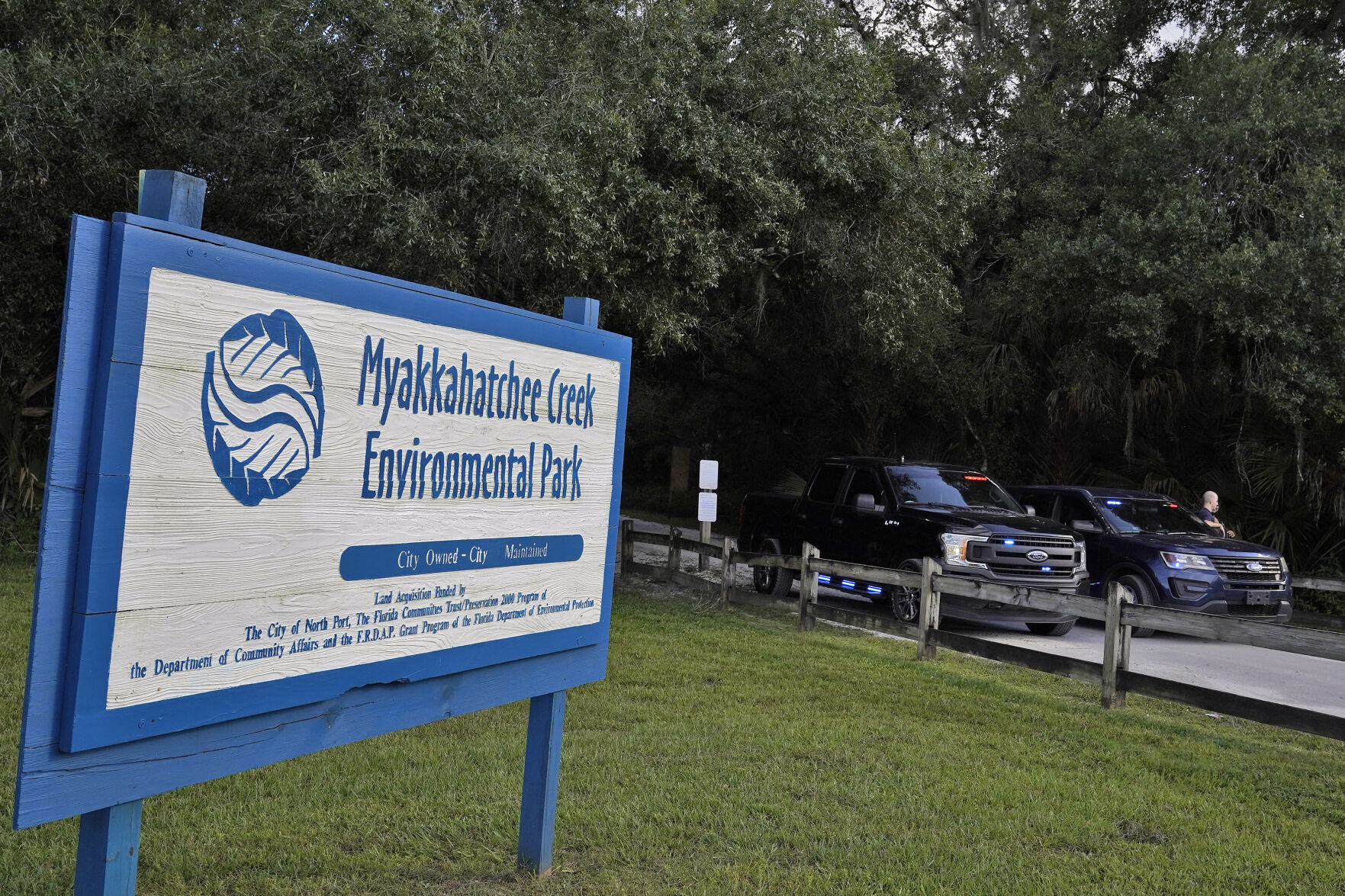 <p>North Port, Fla., police officer block the entrance to the Myakkahatchee Creek Environmental Park Wednesday, Oct. 20, 2021, in North Port, Fla. Items believed to belong to Brian Laundrie and potential human remains were found in a Florida wilderness park during a search for clues in the slaying of Gabby Petito . (AP Photo/Chris O'Meara)</p>
