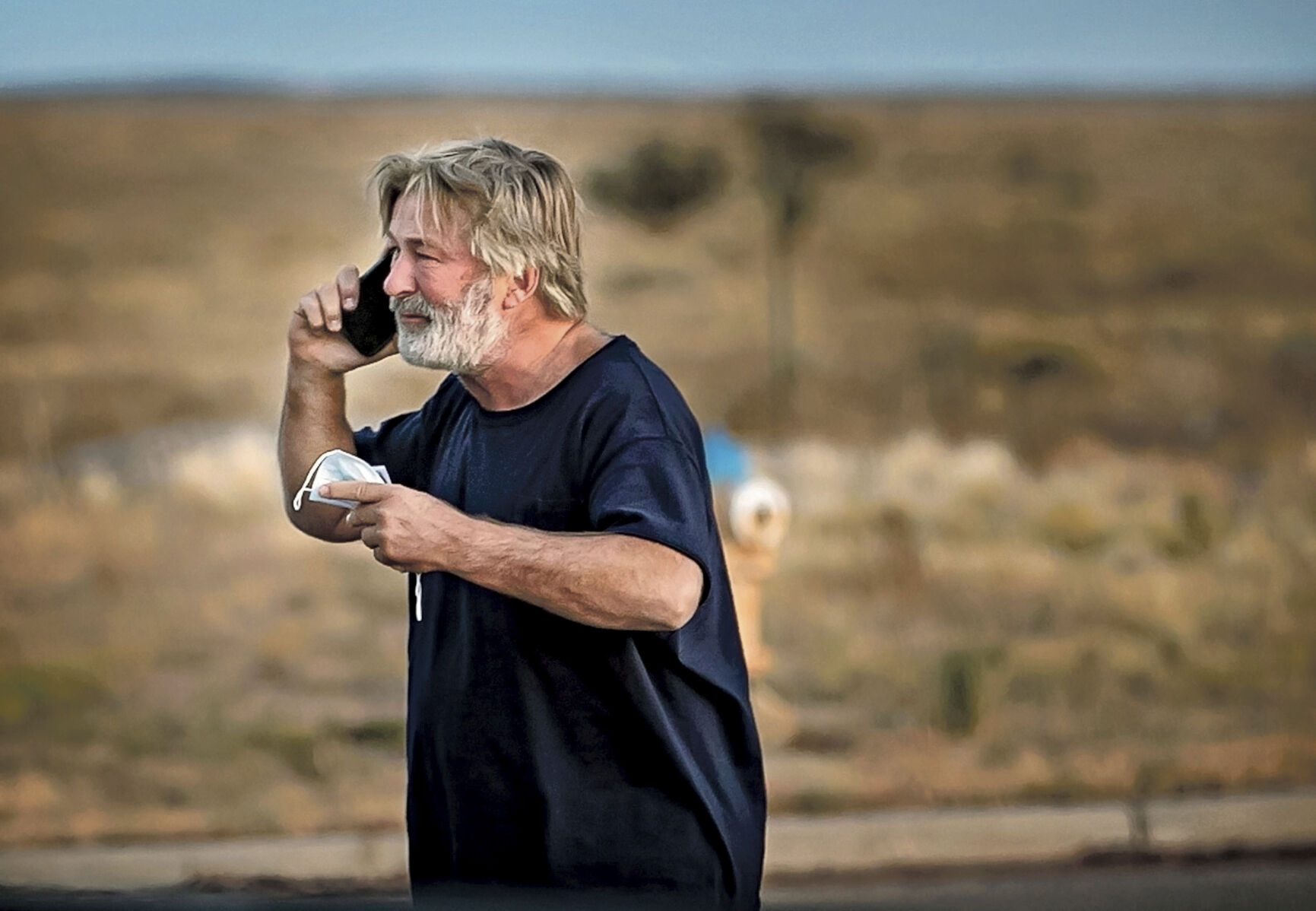 <p>Alec Baldwin speaks on the phone in the parking lot outside the Santa Fe County Sheriff's Office in Santa Fe, N.M., after he was questioned about a shooting on the set of the film "Rust" on the outskirts of Santa Fe, Thursday, Oct. 21, 2021. Baldwin fired a prop gun on the set, killing cinematographer Halyna Hutchins and wounding director Joel Souza, officials said. (Jim Weber/Santa Fe New Mexican via AP)</p>