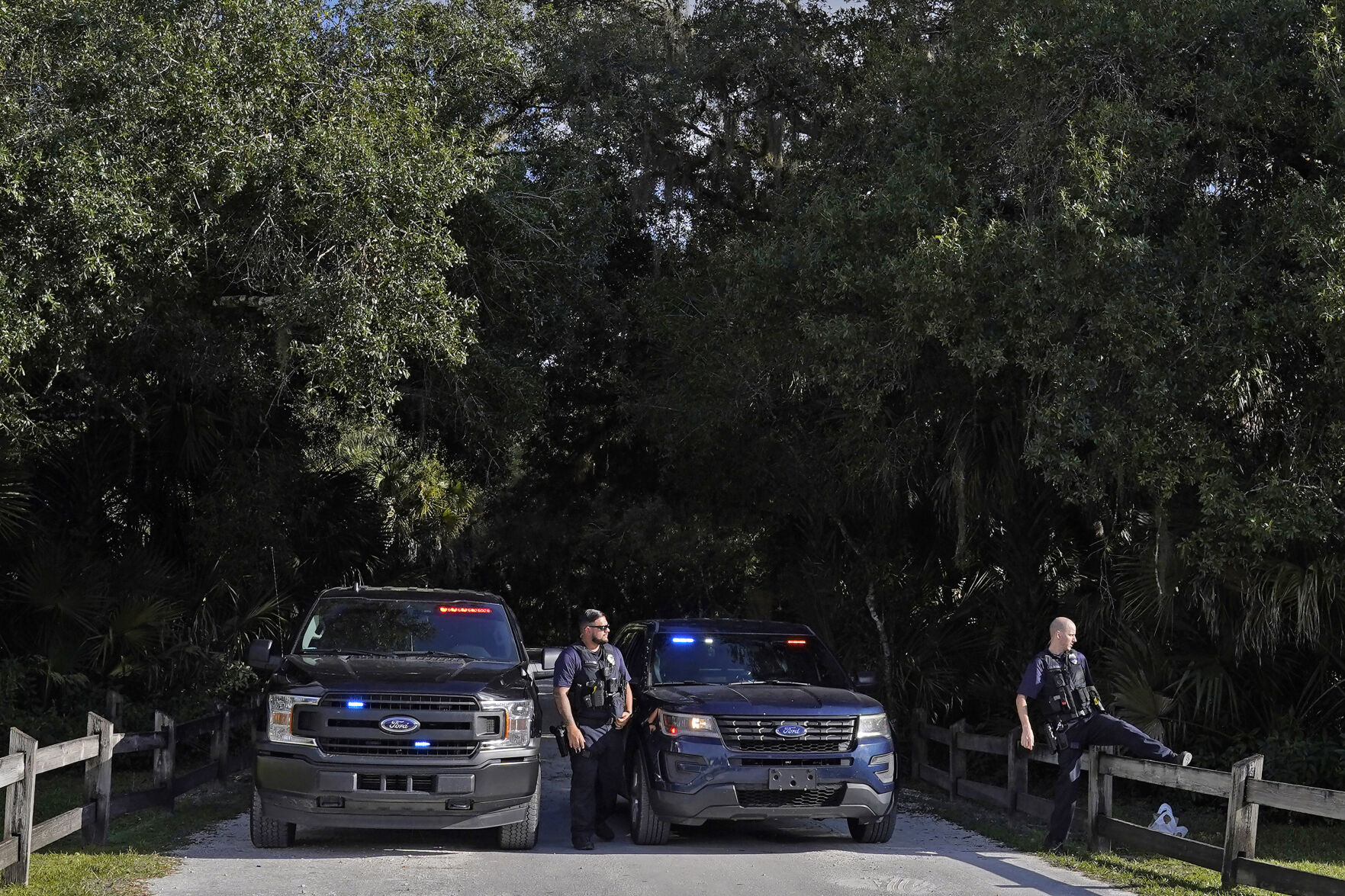 <p>North Port police officers block the entrance to the Myakkahatchee Creek Environmental Park Wednesday, Oct. 20, 2021, in North Port, Fla. Items believed to belong to Brian Laundrie and potential human remains were found in a Florida wilderness park during a search for clues in the slaying of Gabby Petito . (AP Photo/Chris O'Meara)</p>