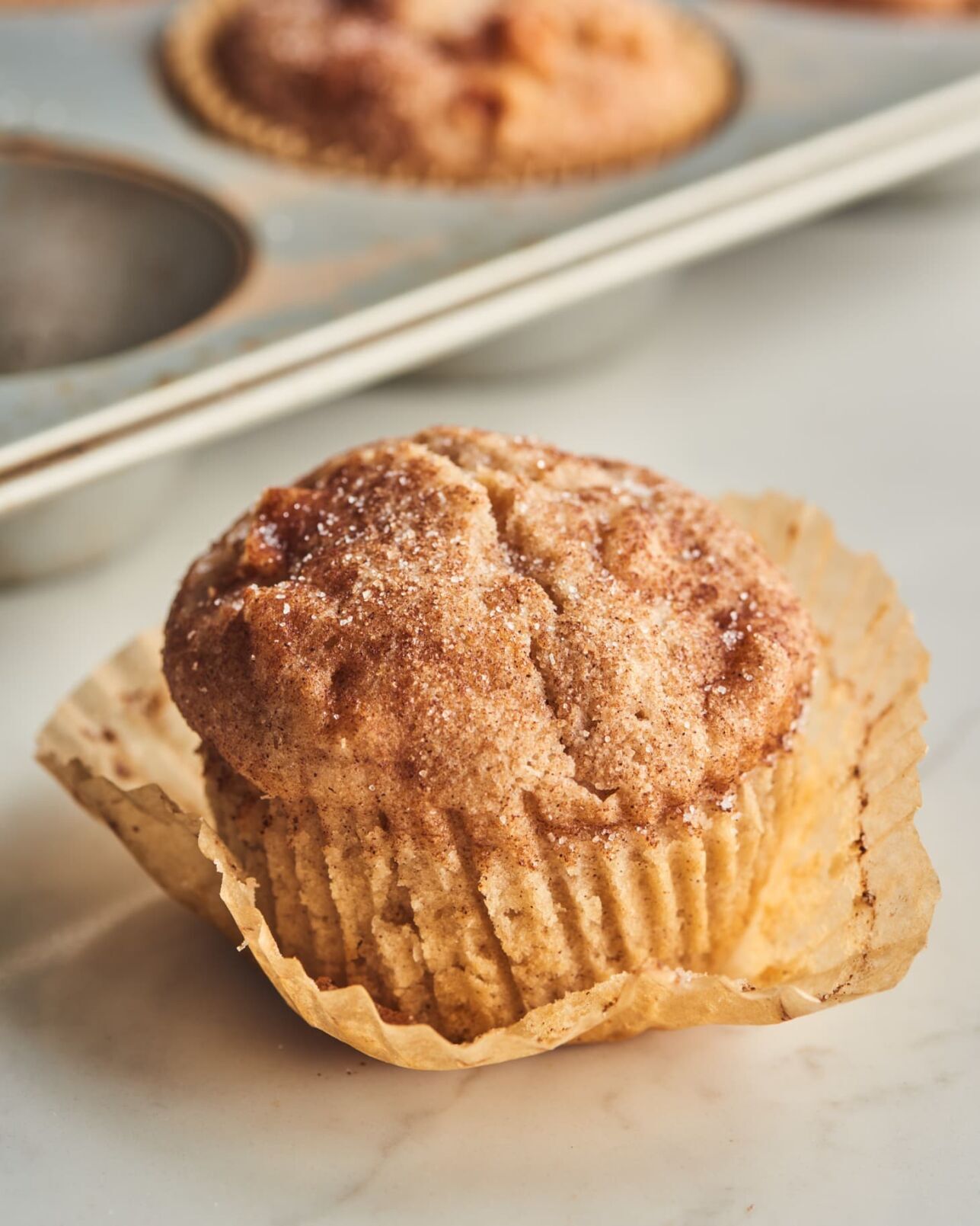 <p>These tender muffins are studded with chunks of fresh apple and showered with plenty of cinnamon-sugar.</p>