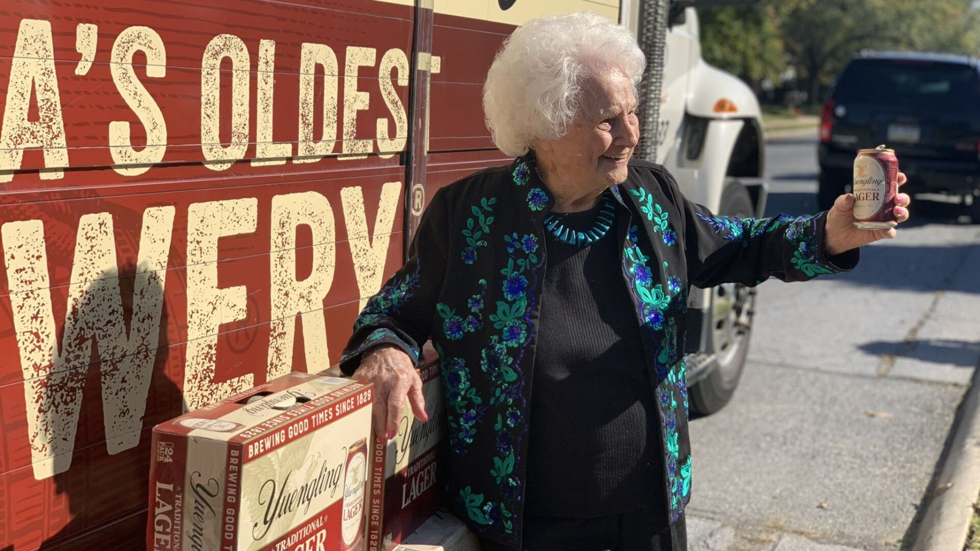 <p>Margaret Dilullo, 106, poses with her special delivery outside her home in Spring Township.</p>