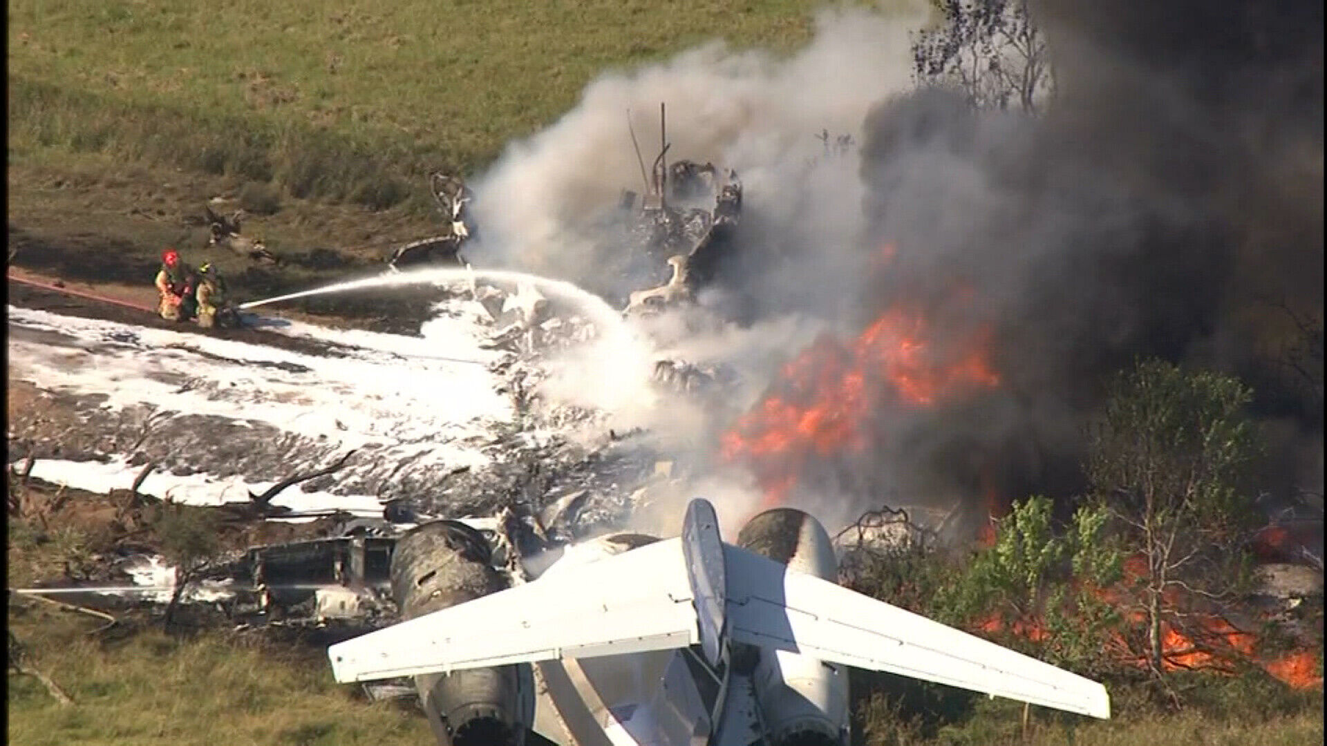 <p>When a plane carrying 21 baseball fans to a playoff game crashed in Houston, pictured here, one passenger remembered hearing the words "get out, get out" as flames started to engulf the aircraft.</p>