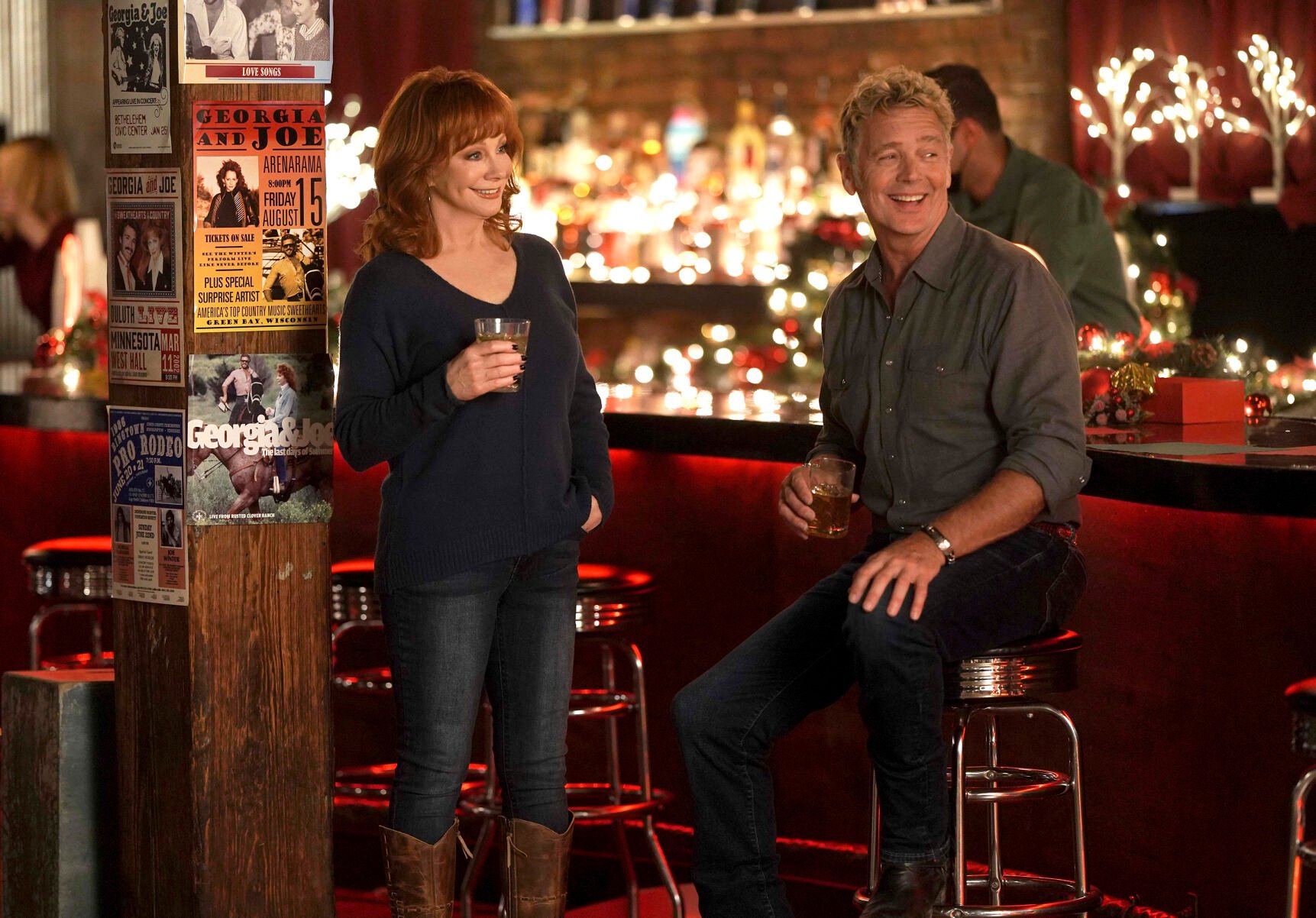 <p>This image released by Lifetime shows Reba McEntire, left, and John Schneider from the holiday special "Reba McEntire's Christmas in Tune," premiering Nov. 26 on Lifetime. (Lifetime via AP)</p>