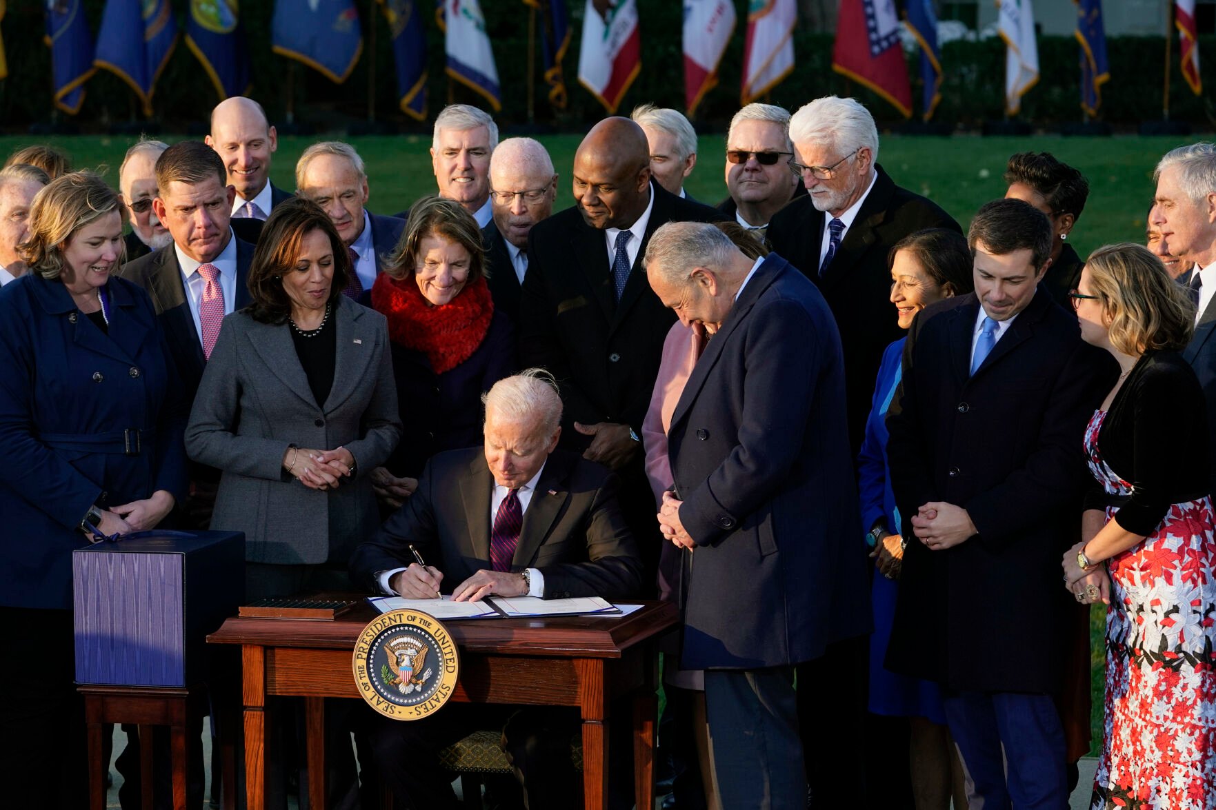 <p>FILE - President Joe Biden signs the .2 trillion bipartisan infrastructure bill into law during a ceremony on the South Lawn of the White House in Washington on Nov. 15, 2021. On Friday, Nov. 19, 2021, The Associated Press reported on stories circulating online spreading falsehoods about why the presidential seal on Biden’s desk was blurred in a recent video that was shared on Vice President Kamala Harris’ Twitter account. (AP Photo/Susan Walsh, File)</p>