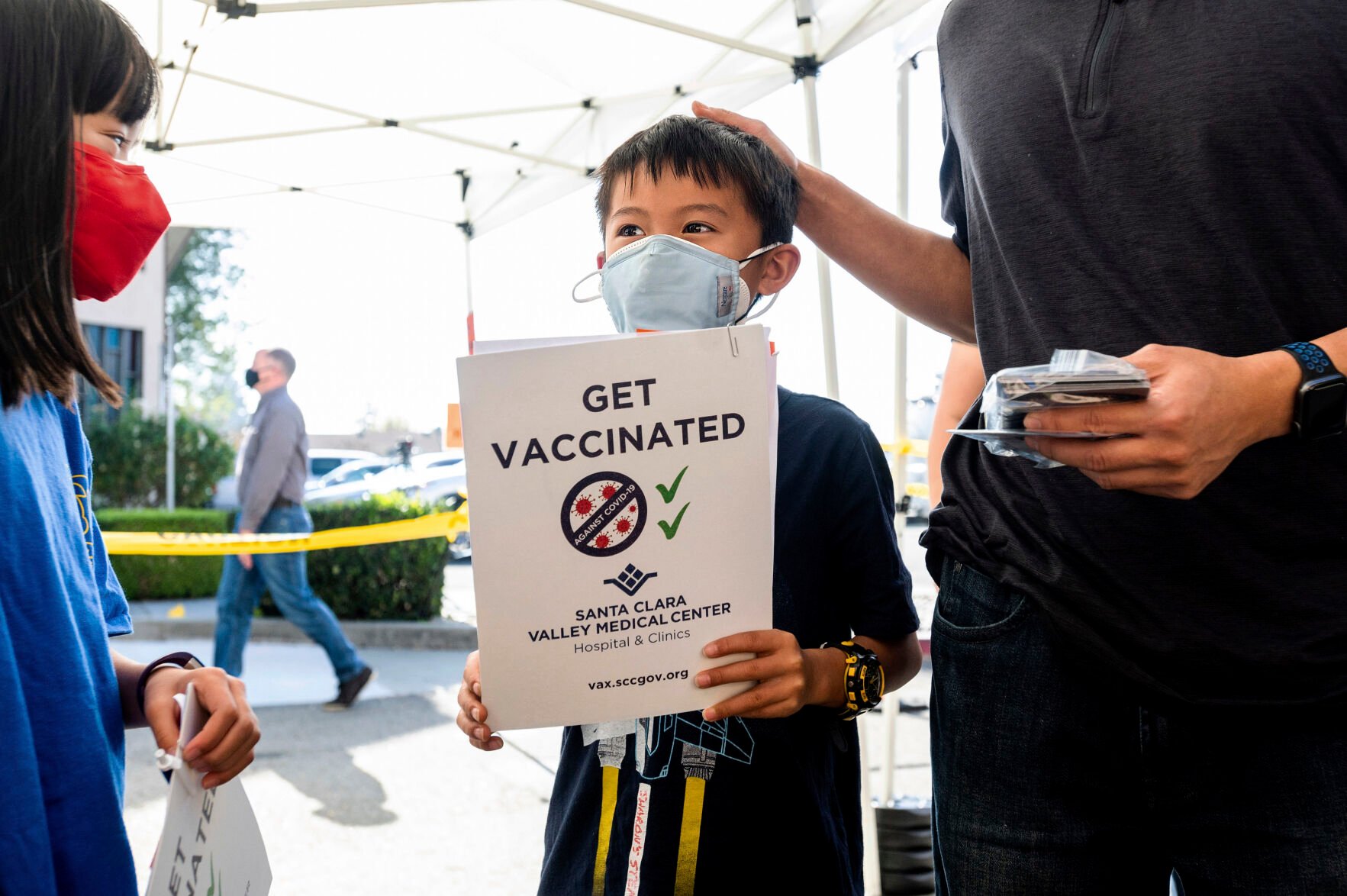 <p>Matthew Yip, 8, waits in line to receive a Pfizer-BioNTech COVID-19 vaccine in San Jose, Calif., on Wednesday, Nov. 3, 2021. (AP Photo/Noah Berger)</p>