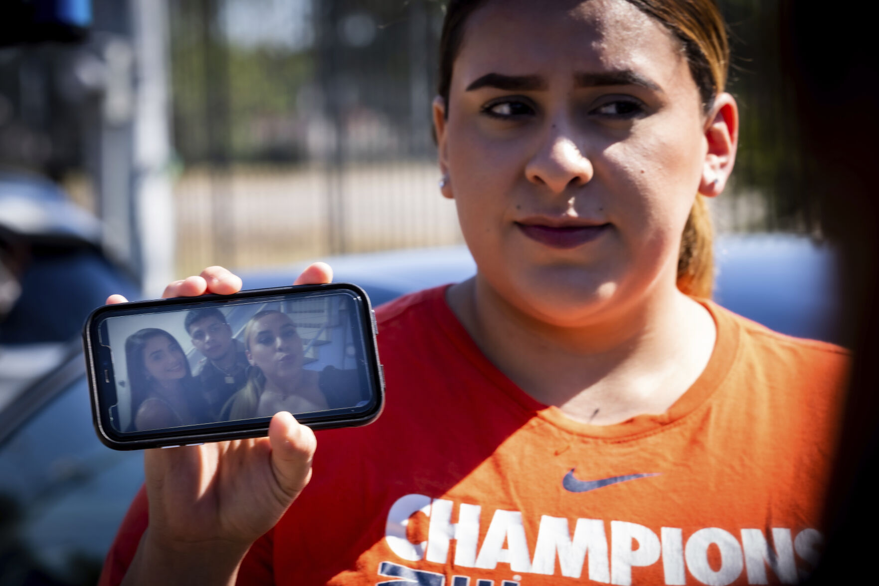 <p>Stacey Sarmiento shows a photo of her posing with her friend, Rudy Pena, who died in a crush of people at the Astroworld music festival in Houston.</p>