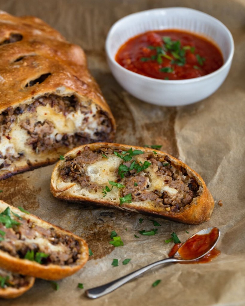 The Kitchn: This Pizza Inspired Sausage Bread Is Stuffed With Cheesy Goodness