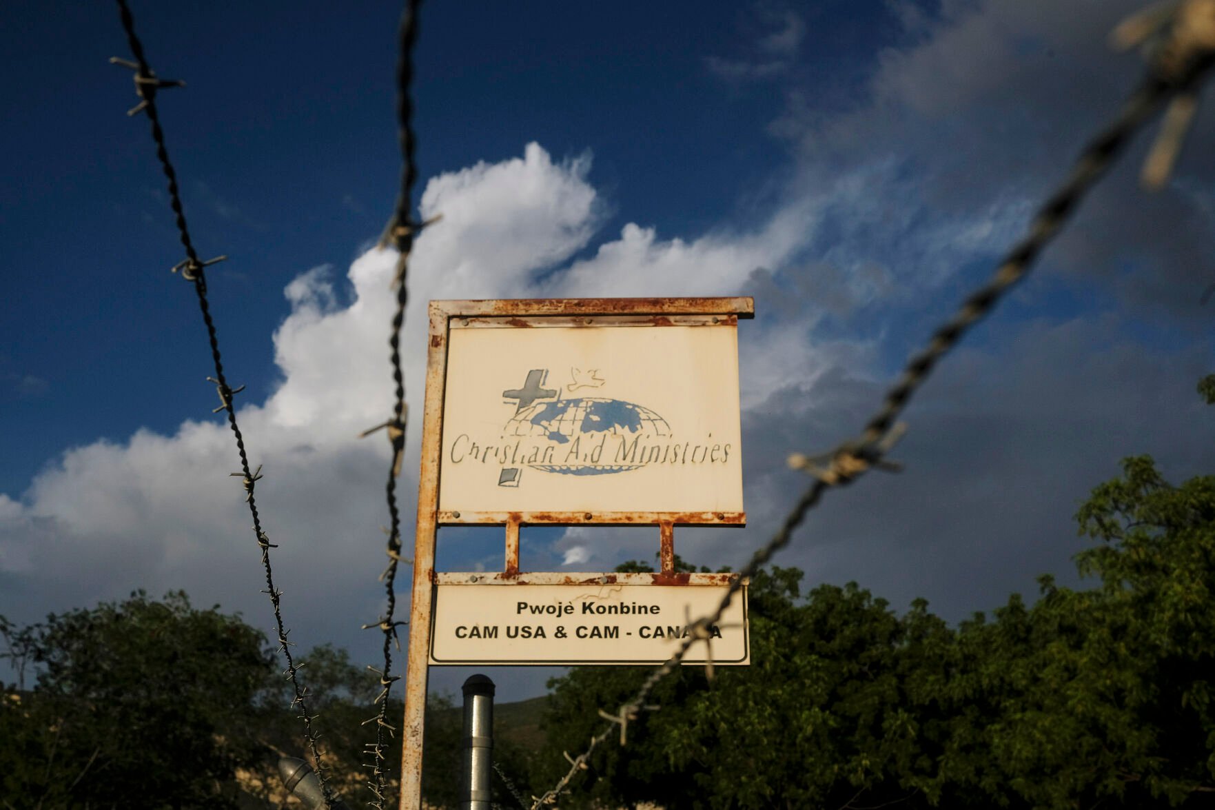 <p>This Oct. 21, 2021, photo shows a sign outside Christian Aid Ministries in Titanyen, Haiti, which had 17 of their members kidnapped.</p>