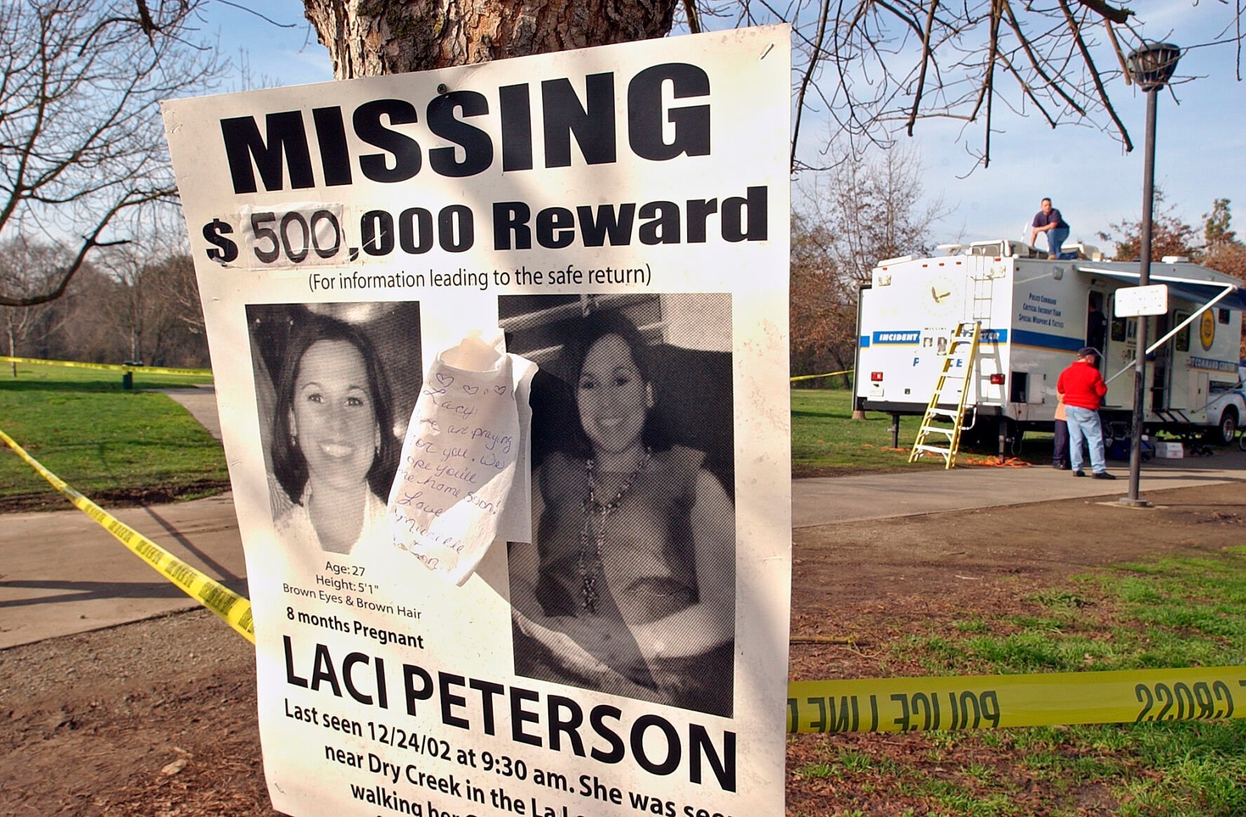 <p>FILE - A missing person poster showing Laci Peterson is seen near the Modesto Police command center in East La Loma Park in Modesto, Calif., on Jan. 2, 2003. Nearly 17 years after being sentenced to die, Scott Peterson was resentenced to life without parole Wednesday, Dec. 8, 2021, during an emotional hearing in which family members of his slain pregnant wife, Laci, called him out for the killing in 2002 and his apparent lack of remorse. (AP Photo/Ben Margot, File)</p>