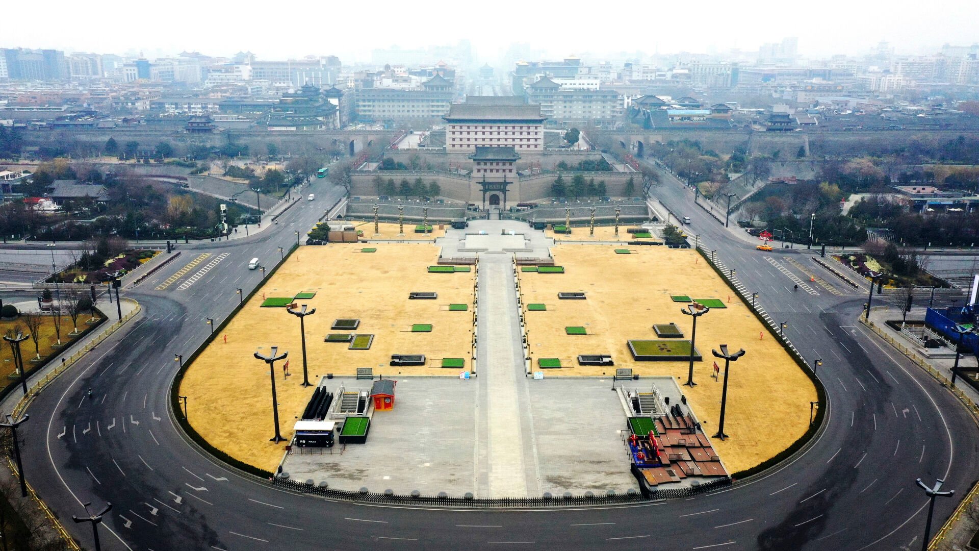 <p>In this photo released by China's Xinhua News Agency, cars drive down a nearly empty street in Xi'an in northwestern China's Shaanxi Province, Thursday, Dec. 23, 2021. </p>
