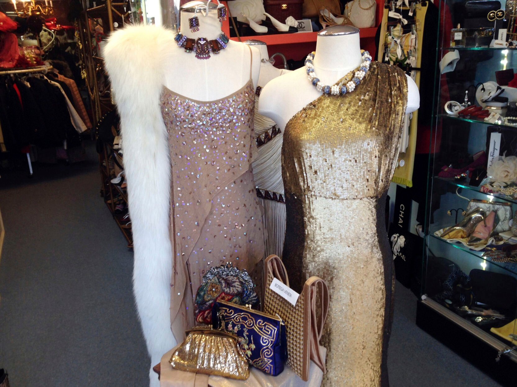 <p>FILE - A pair of evening gowns are displayed at the Paradise Lost consignment store in Palm Beach, Fla., on Feb. 25, 2016. Resale has taken off among some looking to save the planet and spend less on gifts during the most wasteful time of the year _ the December holidays. This year’s supply chain delays have provided extra motivation. (AP Photo/Kelli Kennedy, File)</p>