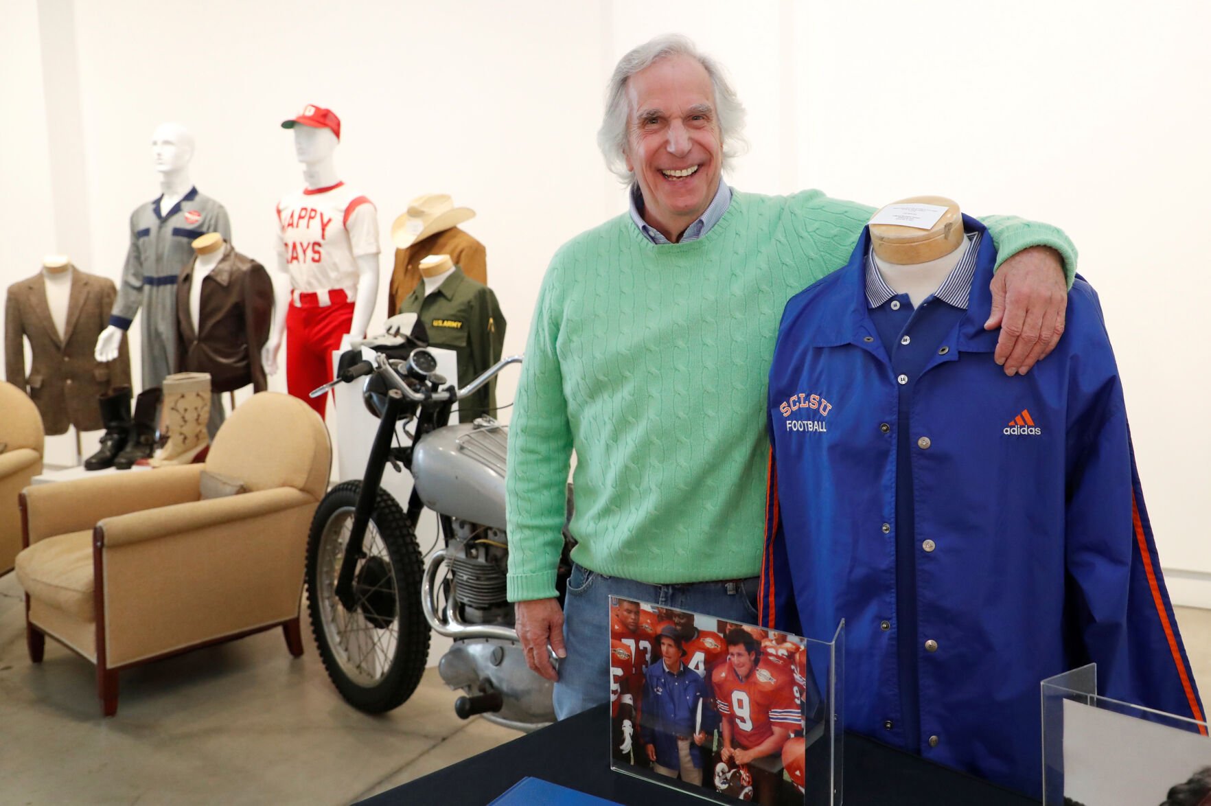 <p><span>Actor Henry Winkler poses with items from his collection that are going up for auction in Los Angeles.</span></p>
