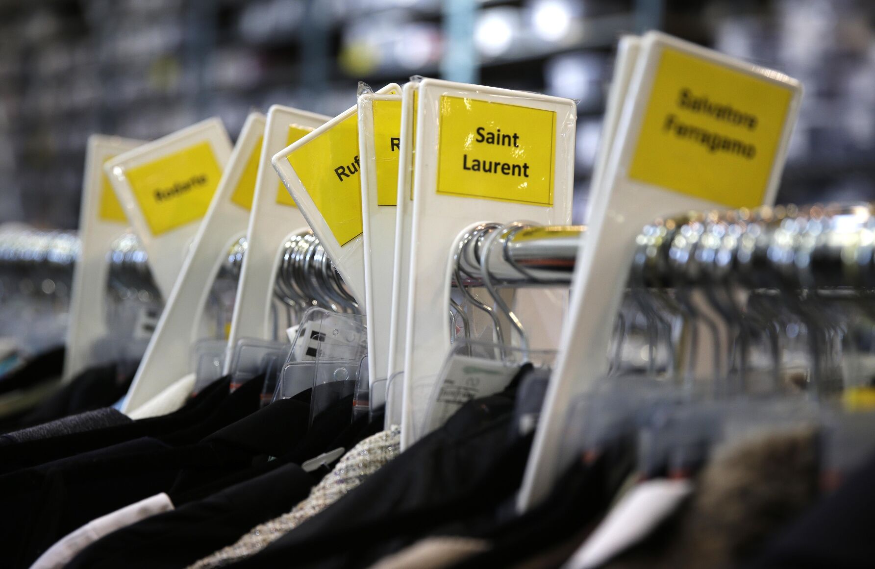 <p>FILE - A rack of women's clothing is categorized by designer at the headquarters of The RealReal in San Francisco on April 9, 2014. Resale has taken off among some looking to save the planet and spend less on gifts during the most wasteful time of the year _ the December holidays. This year's supply chain delays have provided extra motivation. (AP Photo/Eric Risberg, File)</p>