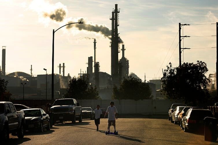 <p>Oil refineries and industries overshadow homes just beyond their fence line in many communities.</p>