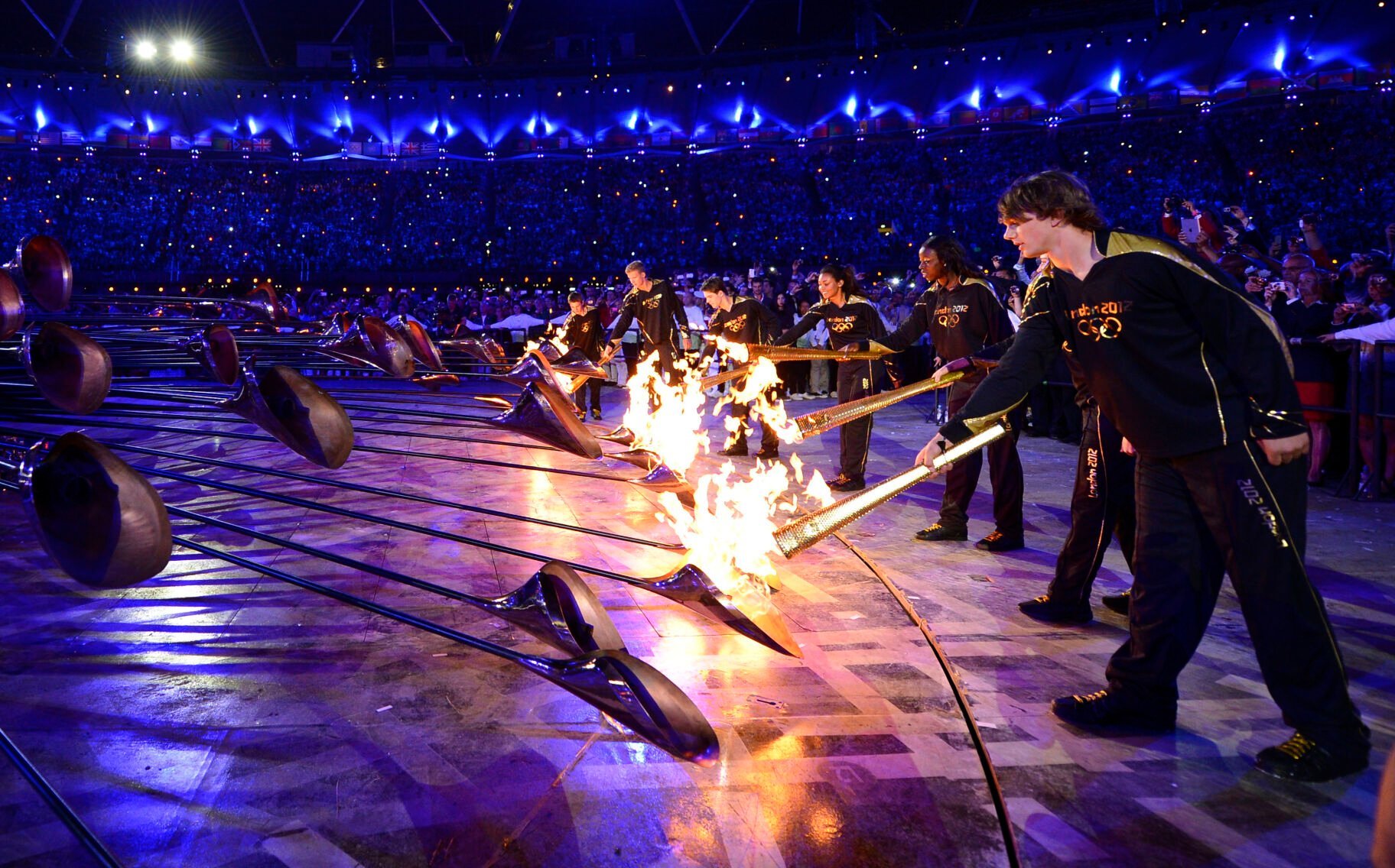 <p>The Olympic cauldron is lit during the Opening Ceremony at the 2012 Summer Olympics, Saturday, July 28, 2012, in London. (AP Photo/Leon Neal, Pool)</p>