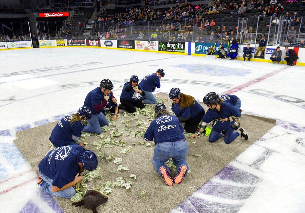 Event Featuring Teachers Crawling For Cash Prompts Apology