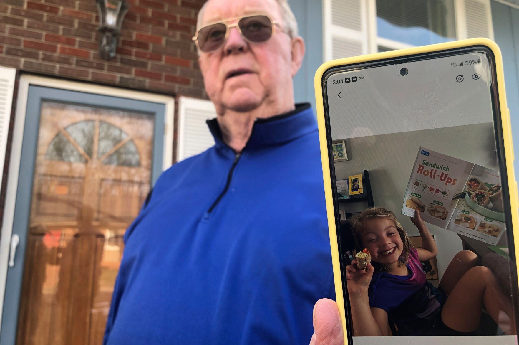 <p>Retiree Andy Roberts displays a photo of his daughter, 5-year-old Tesla, at his home Thursday, Jan. 13, 2022, in St. Albans, W.Va. </p>