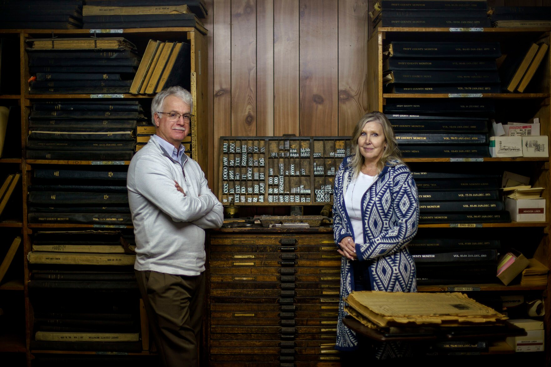 <p>Reed Anfinson, publisher of The Swift County Monitor-News, left, is stands for a portrait with his wife and business partner, Shelly, at the paper's office in Benson, Minn., Wednesday, Dec. 1, 2021. </p>