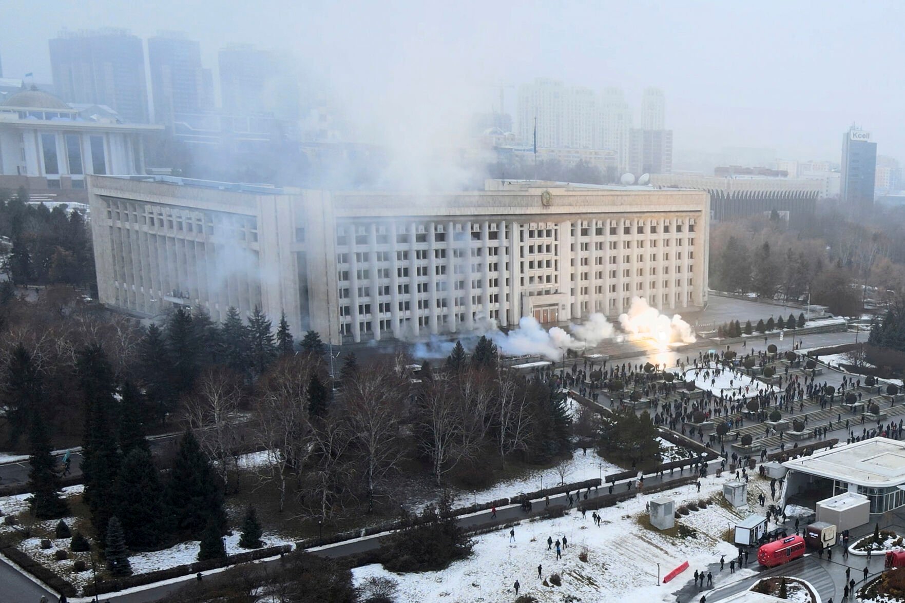 <p>Smoke rises from the city hall building during a protest in Almaty, Kazakhstan, Wednesday, Jan. 5, 2022. News outlets in Kazakhstan are reporting that demonstrators protesting rising fuel prices broke into the mayor's office in the country's largest city and flames were seen coming from inside. Kazakh news site Zakon said many of the demonstrators who converged on the building in Almaty on Wednesday carried clubs and shields.</p>
