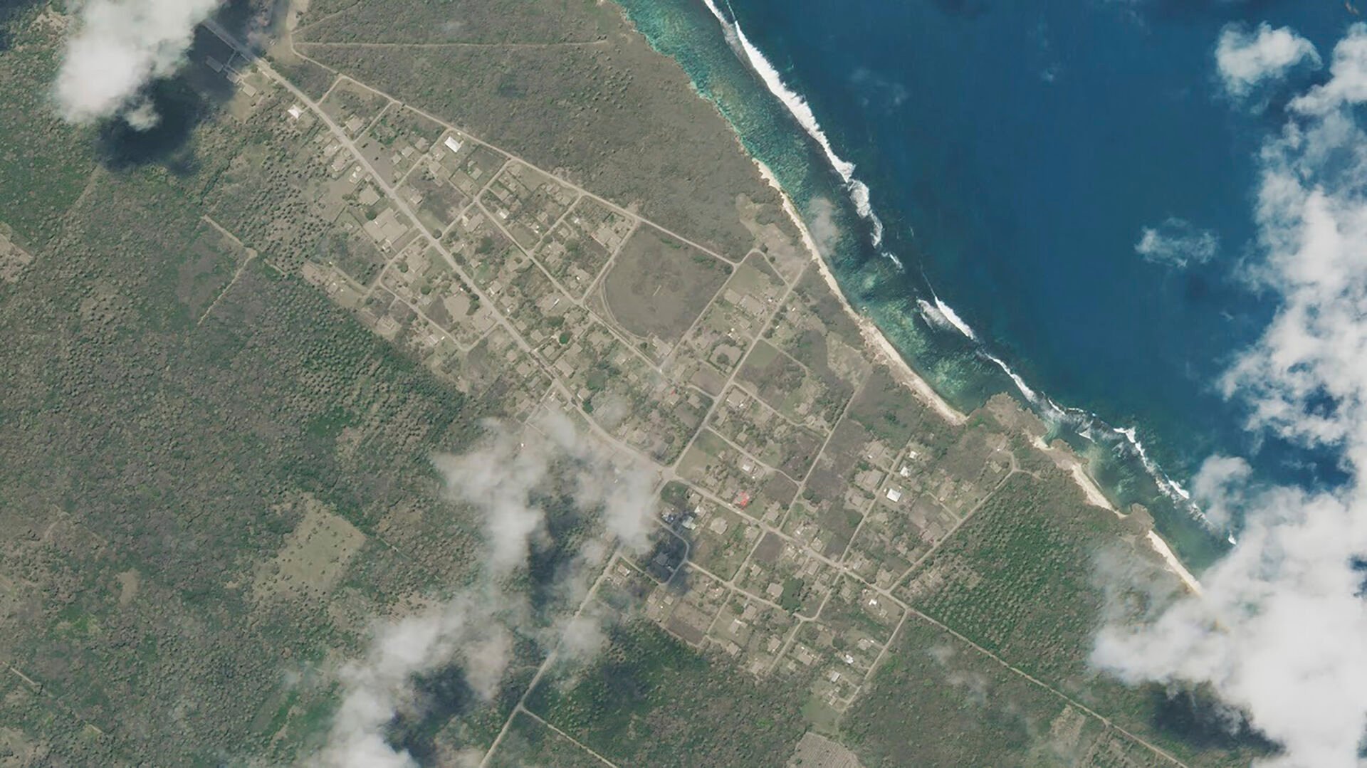 <p>This satellite image provided by Planet Labs PBC, shows Niutoua in Tongatapu, Tonga Monday, Jan. 17, 2022, after a huge undersea volcanic eruption. (Planet Labs PBC via AP)</p>