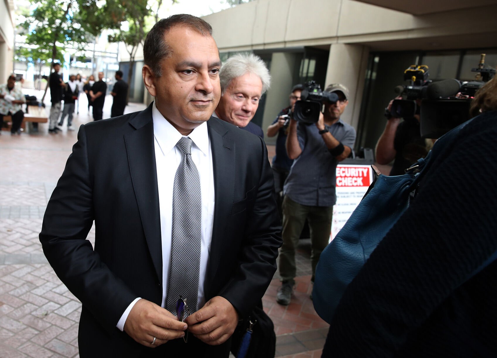 <p>Former Theranos COO Ramesh "Sunny' Balwani leaves the Robert F. Peckham U.S. Federal Court on June 28, 2019 in San Jose, California.</p>