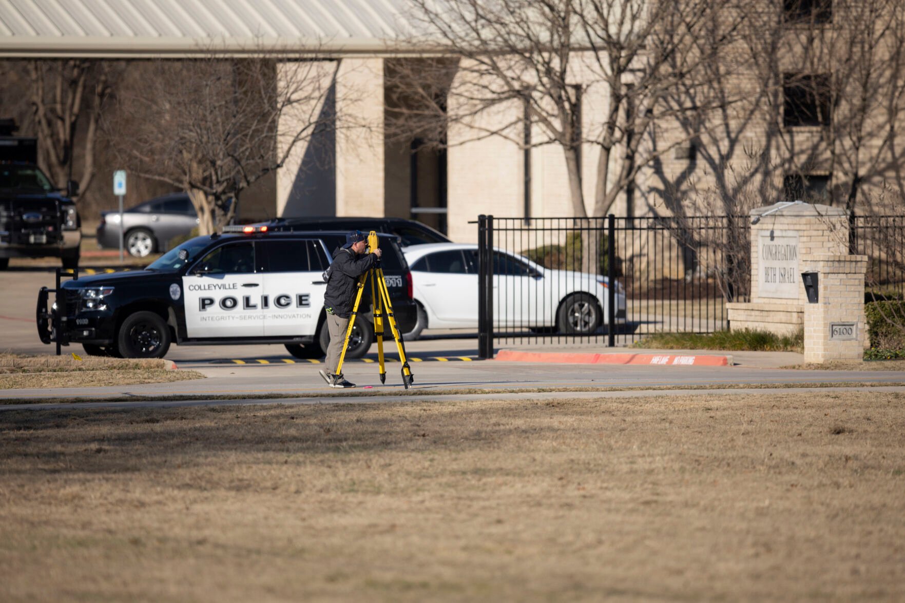 <p>Law enforcement process the scene in front of the Congregation Beth Israel synagogue, Sunday, Jan. 16, 2022, in Colleyville, Texas. A man held hostages for more than 10 hours Saturday inside the temple. The hostages were able to escape and the hostage taker was killed. FBI Special Agent in Charge Matt DeSarno said a team would investigate "the shooting incident." (AP Photo/Brandon Wade)</p>