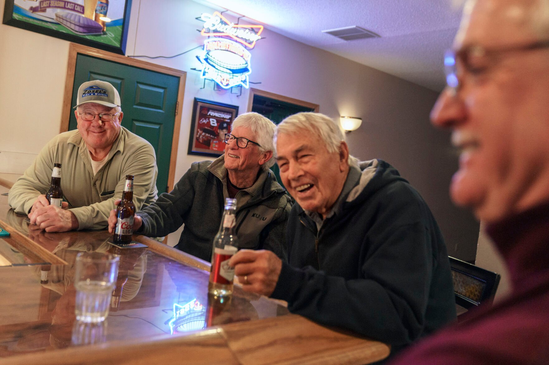 <p>Reed Anfinson, right, who is often tagged as the liberal publisher of the The Swift County Monitor-News, meets up at a bar with John Zosel, from left, Mick Abner and Bill Harrison, part of a weekly gathering made up of mostly Republicans, in Benson, Minn., Tuesday, Nov. 30, 2021. </p>