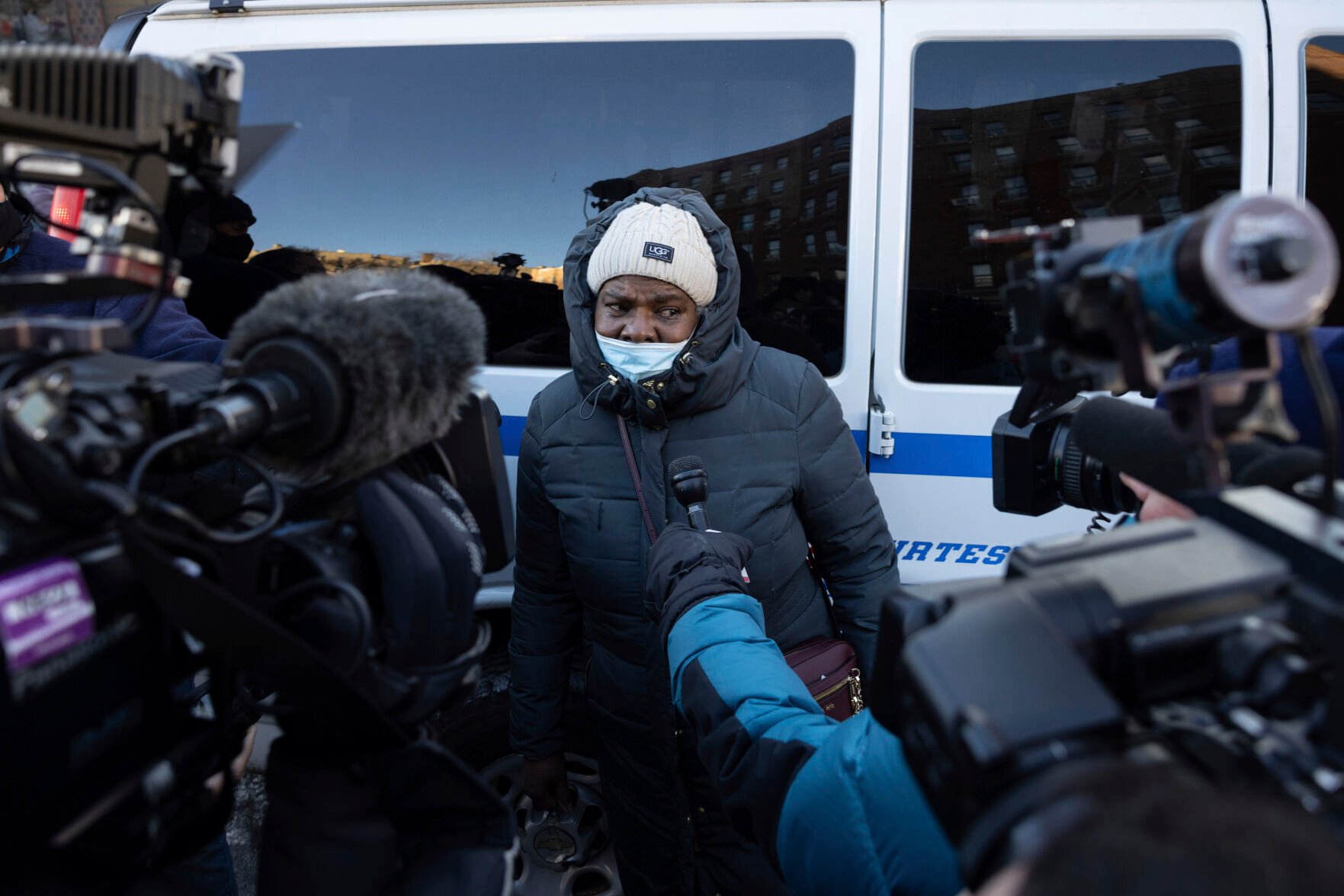 <p>Members of the press interview Tysena Jacobs, a survivor of the fire, outside the apartment building in the Bronx on Monday, Jan. 10, 2022, in New York. </p>
