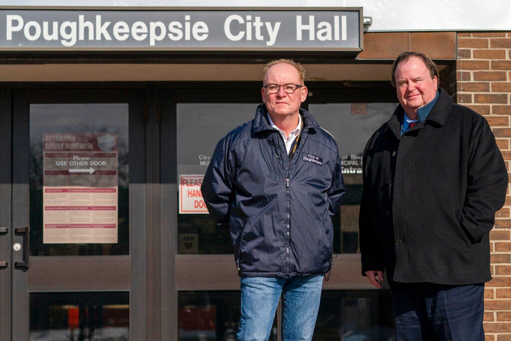<p>Poughkeepsie Mayor Robert Rolison, left, and City Administrator Marc Nelson pose for a photo outside City Hall in Poughkeepsie, N.Y., Tuesday, Jan. 25, 2022. Poughkeepsie was rated by the New York comptroller as the state’s most financially stressed community in 2020. The city has since received more than million from the American Rescue Plan, which it is directing toward public works projects it otherwise couldn't afford. (AP Photo/Mary Altaffer)</p>