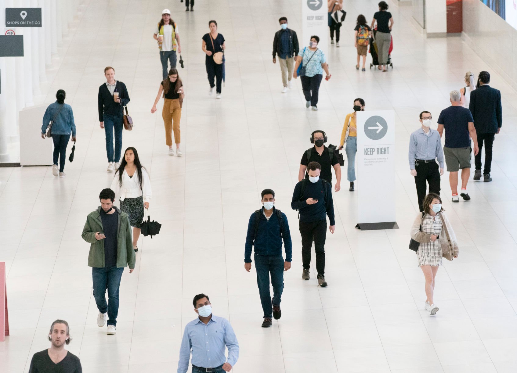 <p>People commute through the World Trade Center on July 9, 2021, in New York.</p>
