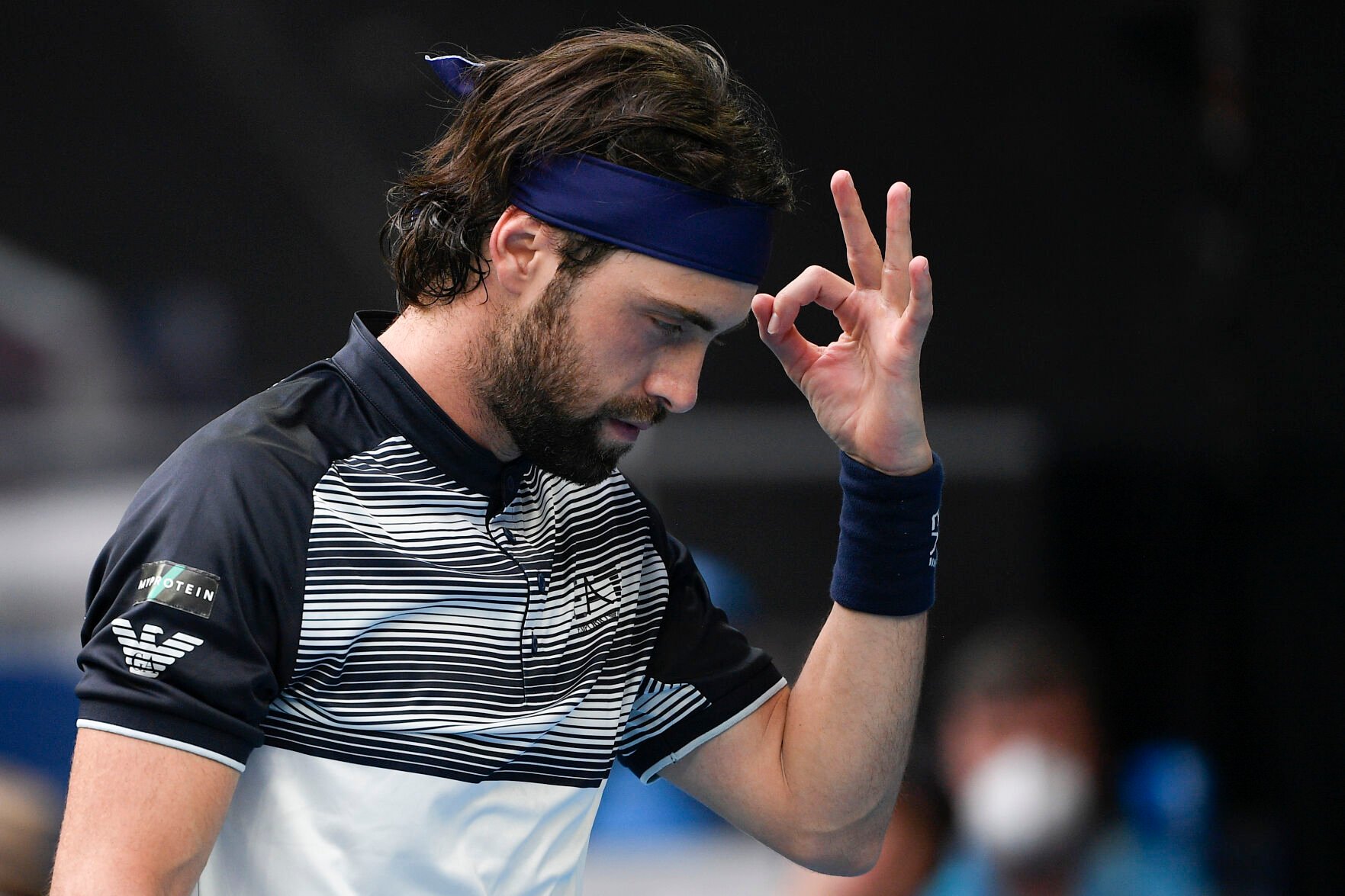 <p>FILE - Nikoloz Basilashvili of Georgia gestures during his first round match against Andy Murray of Britain at the Australian Open tennis championships in Melbourne, Australia, Tuesday, Jan. 18, 2022. On Friday, Jan. 21, The Associated Press reported on stories circulating online incorrectly claiming three tennis players, Basilashvili, Nick Kyrgios and Dalila Jakupovic — were forced to drop out of this year’s Australian Open after they experienced chest-related health issues.(AP Photo/Andy Brownbill)</p>